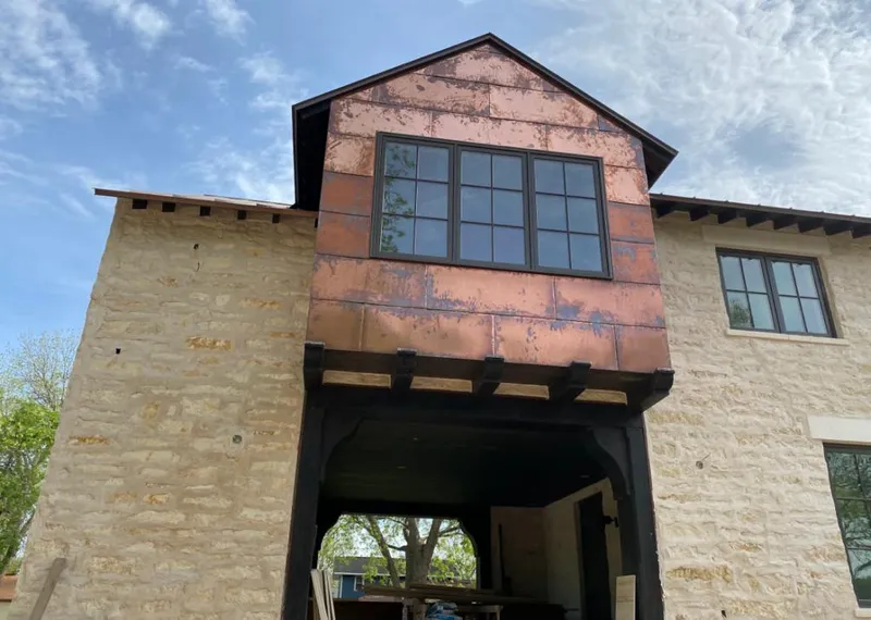 Copper metal panel facade on a stone building for Roof Repair in Moreno Valley